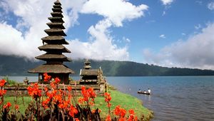 Preview wallpaper asia, island, structure, flowers, mountains, boat, people