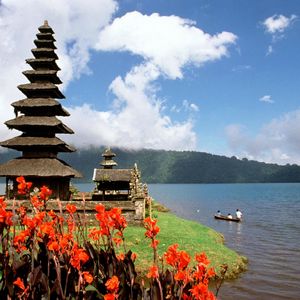 Preview wallpaper asia, island, structure, flowers, mountains, boat, people