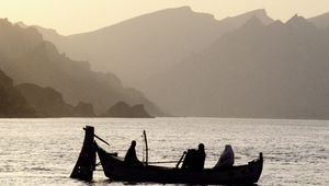 Preview wallpaper asia, mountains, fog, water, lake, boat, people