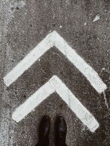 Preview wallpaper asphalt, marking, arrows, feet, shoes