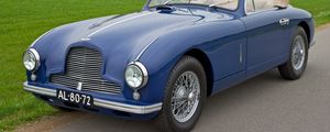 Preview wallpaper aston martin, 1951, blue, side view, style, cars, nature, grass, houses, trees