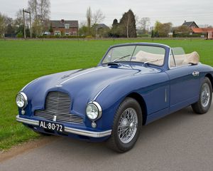 Preview wallpaper aston martin, 1951, blue, side view, style, cars, nature, grass, houses, trees