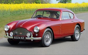 Preview wallpaper aston martin, 1958, red side view, style, cars, retro, nature, field, flowers, trees, asphalt