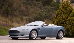 Preview wallpaper aston martin, db92004, blue, side view, sports, trees, shrubs