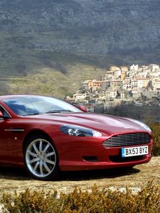 Preview wallpaper aston martin, db9, 2004, red, side view, style, cars, nature, trees, houses