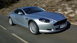 Preview wallpaper aston martin, db9, 2004, silver metallic, side view, style, cars, speed, nature, trees, asphalt