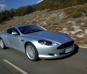 Preview wallpaper aston martin, db9, 2004, silver metallic, side view, style, cars, speed, nature, trees, asphalt