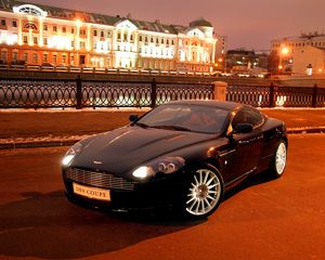 Preview wallpaper aston martin, db9, 2004, black, front view, style, cars, city, house, lights, asphalt