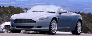 Preview wallpaper aston martin, db9, 2004, blue, front view, style, cars, nature, mountains, trees