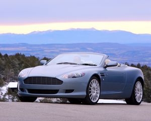 Preview wallpaper aston martin, db9, 2004, blue, front view, style, cars, nature, mountains, trees