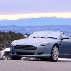 Preview wallpaper aston martin, db9, 2004, blue, front view, style, cars, nature, mountains, trees