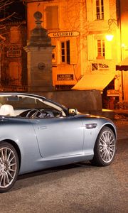 Preview wallpaper aston martin, db9, 2004, blue, side view, style, sports, car, street, house, monument, tree, lamp
