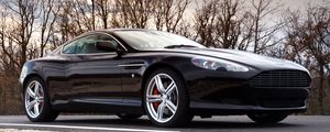 Preview wallpaper aston martin, db9, 2006, black, side view, style, cars, sports, trees, sky