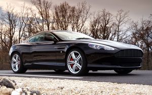 Preview wallpaper aston martin, db9, 2006, black, side view, style, cars, sports, trees, sky