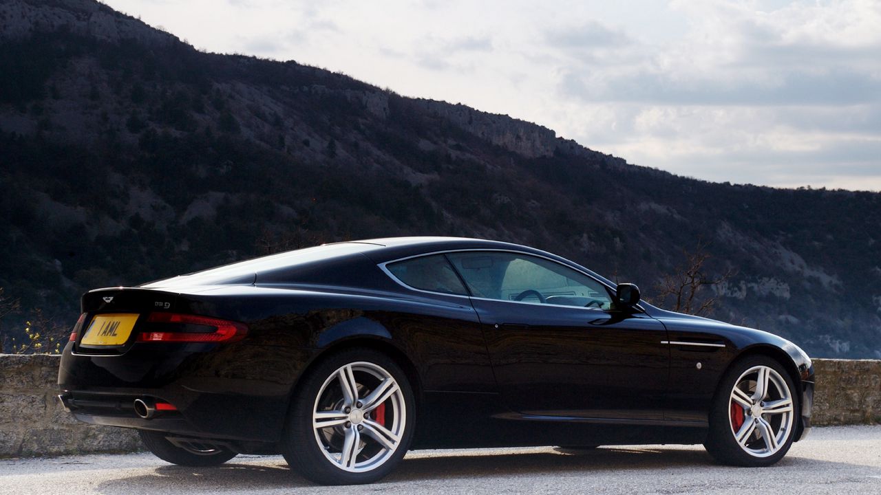 Wallpaper aston martin, db9, 2006, black, side view, style, cars, sports, nature, sky, mountains, trees