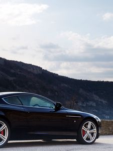 Preview wallpaper aston martin, db9, 2006, black, side view, style, cars, sports, nature, sky, mountains, trees