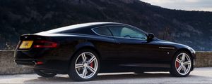 Preview wallpaper aston martin, db9, 2006, black, side view, style, cars, sports, nature, sky, mountains, trees