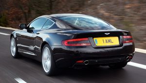 Preview wallpaper aston martin, db9, 2006, black, rear view, style, cars, speed, nature, trees