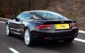 Preview wallpaper aston martin, db9, 2006, black, rear view, style, cars, speed, nature, trees