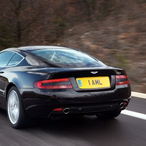 Preview wallpaper aston martin, db9, 2006, black, rear view, style, cars, speed, nature, trees