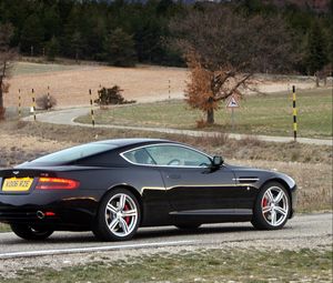 Preview wallpaper aston martin, db9, 2006, black, side view, style, sports, cars, nature, trees