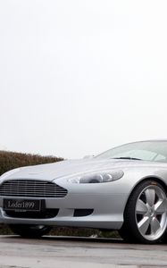 Preview wallpaper aston martin, db9, 2007, silver metallic, side view, style, sports, cars, trees, shrubs