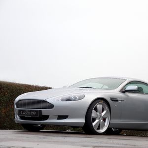 Preview wallpaper aston martin, db9, 2007, silver metallic, side view, style, sports, cars, trees, shrubs