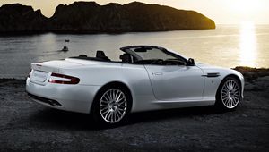 Preview wallpaper aston martin, db9, 2008, white, side view, style, cars, nature, sea, sunset, rocks