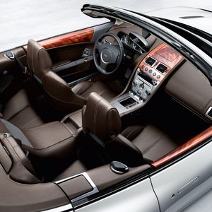 Preview wallpaper aston martin, db9, 2008, brown, top view, salon, interior, steering wheel, speedometer