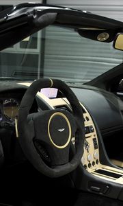 Preview wallpaper aston martin, db9, 2009, black, salon, interior, steering wheel, speedometer