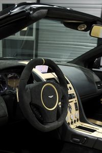 Preview wallpaper aston martin, db9, 2009, black, salon, interior, steering wheel, speedometer