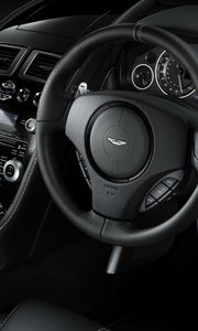 Preview wallpaper aston martin, db9, 2010, black, salon, interior, steering wheel, speedometer