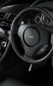 Preview wallpaper aston martin, db9, 2010, black, salon, interior, steering wheel, speedometer