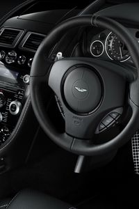 Preview wallpaper aston martin, db9, 2010, black, salon, interior, steering wheel, speedometer