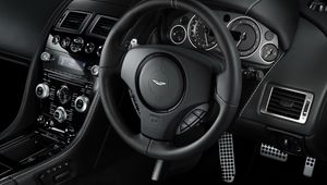 Preview wallpaper aston martin, db9, 2010, black, salon, interior, steering wheel, speedometer