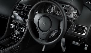 Preview wallpaper aston martin, db9, 2010, black, salon, interior, steering wheel, speedometer