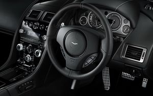 Preview wallpaper aston martin, db9, 2010, black, salon, interior, steering wheel, speedometer