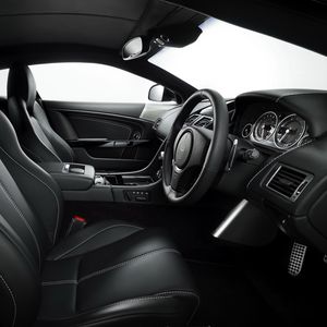 Preview wallpaper aston martin, db9, 2010, black, salon, interior, steering wheel, speedometer