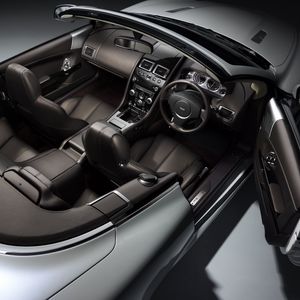 Preview wallpaper aston martin, db9, 2010, black, salon, interior, steering wheel, speedometer