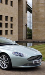 Preview wallpaper aston martin, db9, 2010, blue metallic, side view, style, sports, auto, building, grass