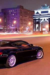 Preview wallpaper aston martin, db9, black, side view, style, cars, city, buildings, lights, asphalt