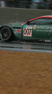 Preview wallpaper aston martin, dbr9, 2005, green, side view, style, sports, cars, speed, wet asphalt