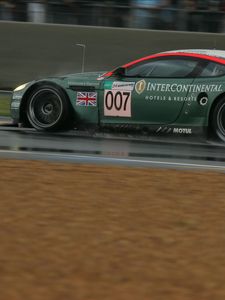 Preview wallpaper aston martin, dbr9, 2005, green, side view, style, sports, cars, speed, wet asphalt