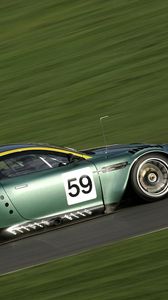 Preview wallpaper aston martin, dbr9, 2005, green, side view, style, sports, cars, speed, grass