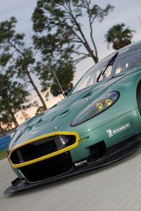 Preview wallpaper aston martin, dbr9, 2005, green, front view, style, cars, sports, nature, trees, asphalt