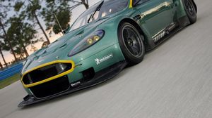 Preview wallpaper aston martin, dbr9, 2005, green, front view, style, cars, sports, nature, trees, asphalt