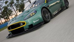 Preview wallpaper aston martin, dbr9, 2005, green, front view, style, cars, sports, nature, trees, asphalt