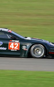 Preview wallpaper aston martin, dbrs9, 2005, black, side view, style, sports, cars, speed, grass