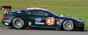 Preview wallpaper aston martin, dbrs9, 2005, black, side view, style, sports, cars, speed, grass