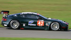 Preview wallpaper aston martin, dbrs9, 2005, black, side view, style, sports, cars, speed, grass